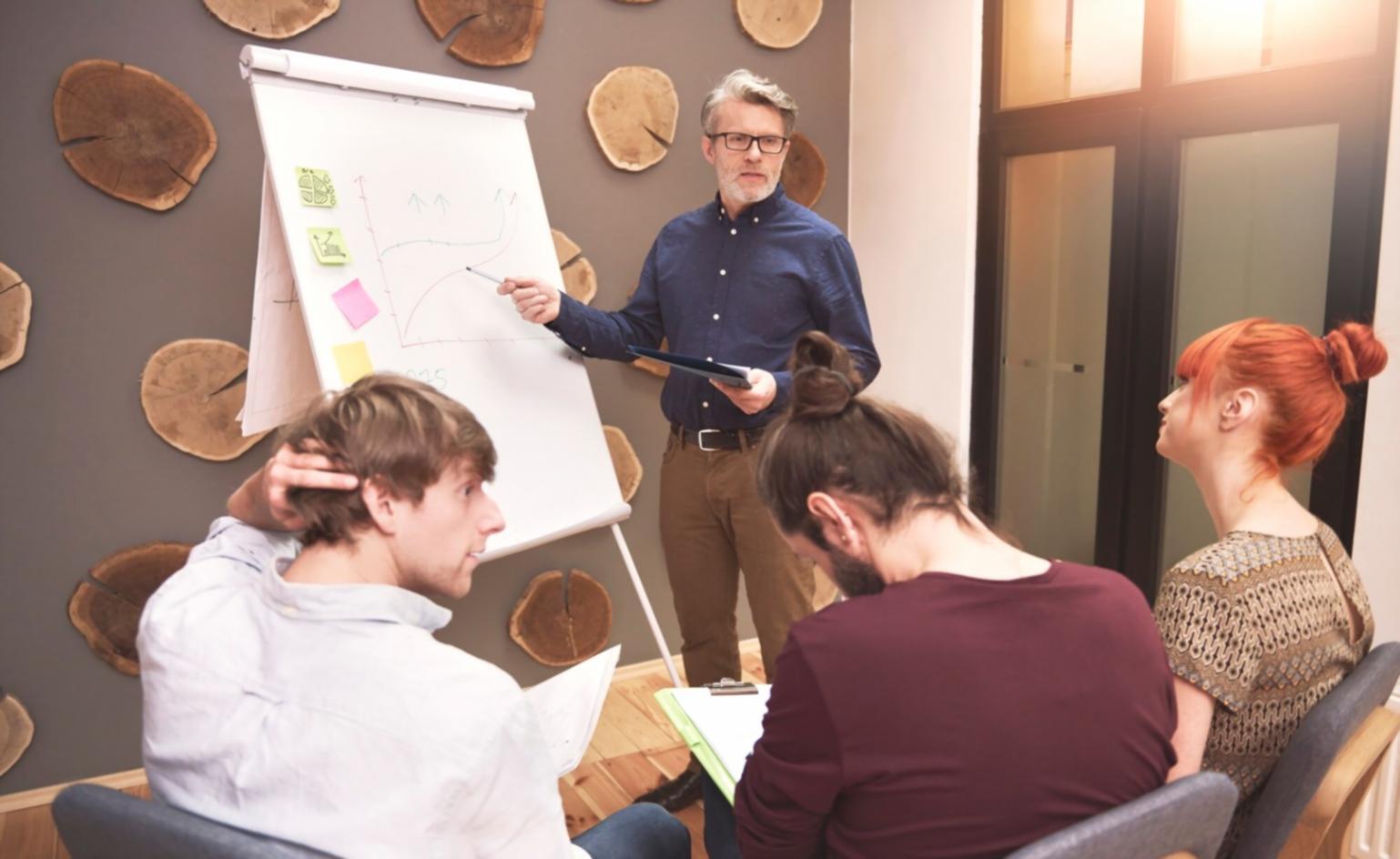 Professional development session showing financial modeling techniques and analytical frameworks